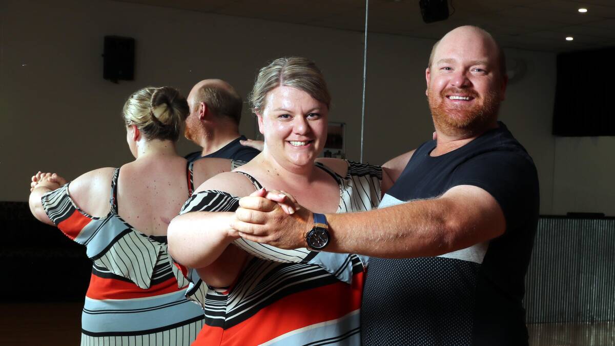 WALTZING AWAY: Angela Boulton takes close friend Gavin Hulm for a spin at Foxtrot Dance Studio. Angela is fundraising to pay for Gavin's cancer treatment by putting on a concert. Picture: Les Smith