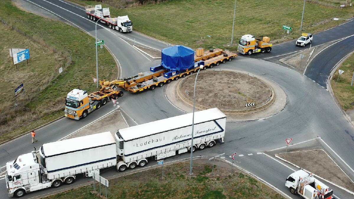 WIDE LOAD: The Wallendbeen roundabout gained plenty of attention on Wednesday with this convoy, reportedly hauling mining equipment. Picture: Scott Sanders