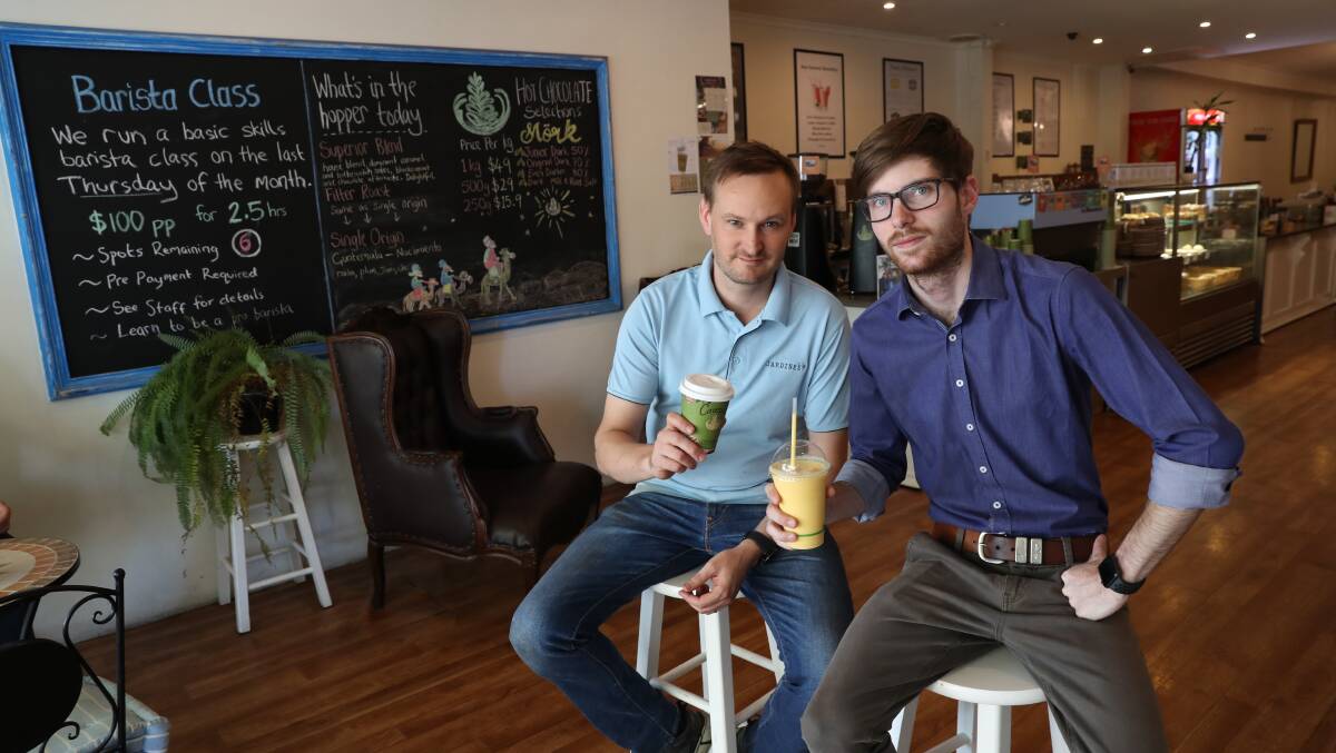 LOCAL LOVE: Rob Illsley of Jardine's Cafe and Blowes Clothing manager Joshua Brame won't hesitate to recommend each other's businesses to shoppers. Now, they're hoping to see support for other local shopfronts. Picture: Les Smith