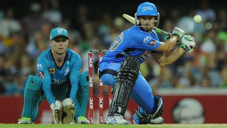 Alex Ross playing a trademark sweep for the Adelaide Strikers against the Brisbane Heat, the team he's set to join this summer.  Photo: Matt Roberts