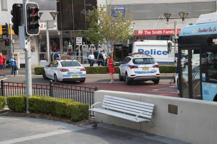 Police work a crime zone after a reported shooting in Bankstown  CBD in front of Chemist Warehouse. Photo by Cole Bennetts