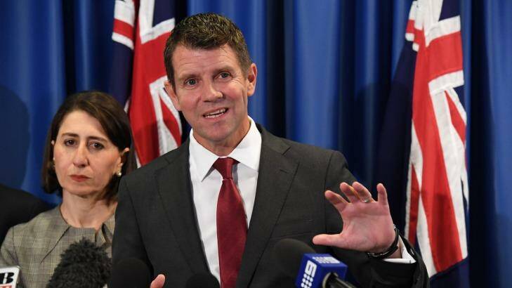 NSW Premier Mike Baird and Treasurer Gladys Berejiklian are close to handing over the land titles registry to the private sector. Photo: Peter Rae