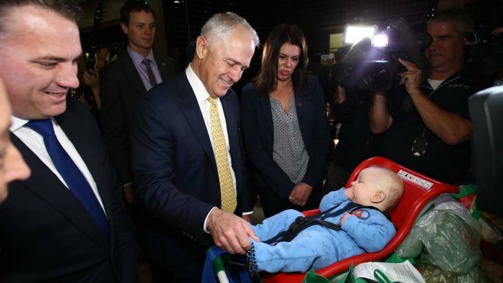 Prime Minister Malcolm Turnbull meets four-month-old Ezekiel during election campaigning. Photo: Andrew Meares