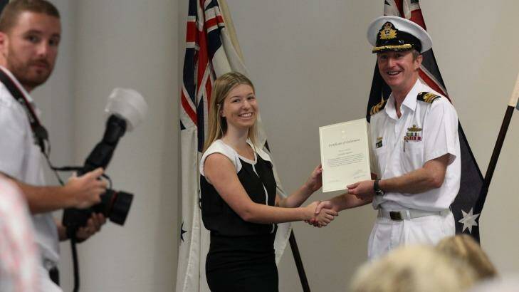 New recruit Gabrielle Saunders with Commander Todd Wilson at Monday's enlistment ceremony in Parramatta. Photo: Peter Rae