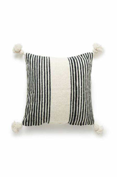 Moroccan wool pom pom cushion, from $123, sizes available: 50cm x 50cm & 60cm x 60cm, barefootgypsy.com.au. Photo: Rufus & Cooper
