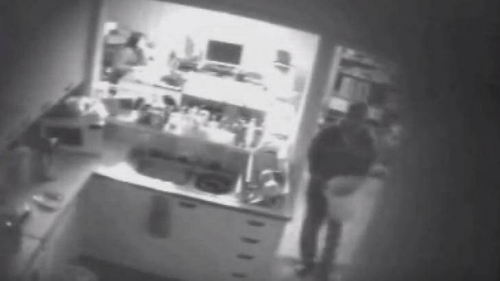 Another still from police surveillance video shows Robert Xie destroying shoeboxes. Photo: Stephanie Gardiner