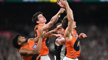 The Giants' Sam Taylor (centre) is looking forward to playing the in-form but "smug" Sydney Swans. (Joel Carrett/AAP PHOTOS)