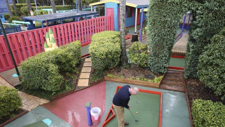Tony Smith plays at the Ermington Putt-Putt centre, which is under
threat from a development proposal for 1000 units. Photo: Brendan Esposito