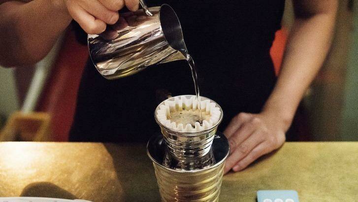A barista prepares pour-over coffee at Gumption by Coffee Alchemy. Photo: Christopher Pearce