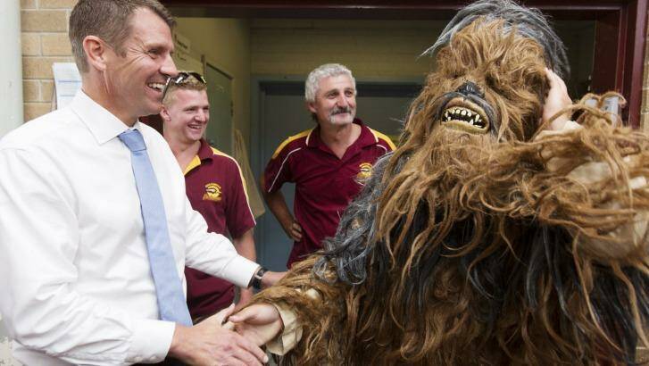 Chewie?: Mike Baird meets a yowie mascot at Queanbeyan Basketball Centre. Photo: James Brickwood