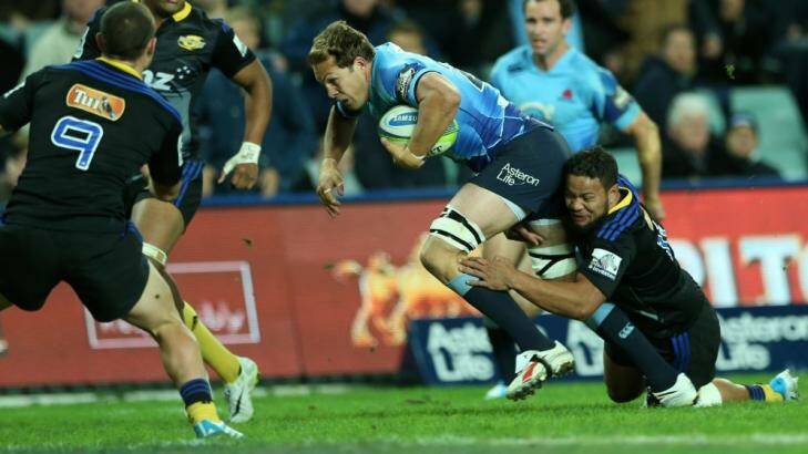 Try time: Stephen Hoiles scores against the Hurricanes in May. Photo: Anthony Johnson