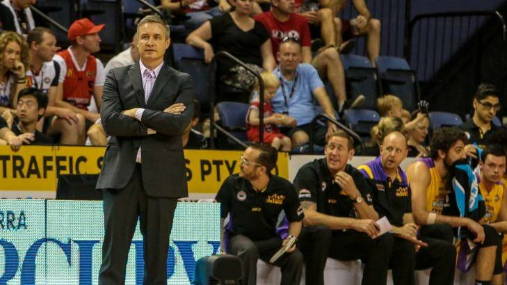 Loss in Wollongong: Damian Cotter looks bemused during the Sydney Kings' loss to Illawarra. His replacement, Joe Connelly, is seated on the bench in between fellow assistant coach Ben Knight and centre Julian Khazzouh. Photo: Adam McLean