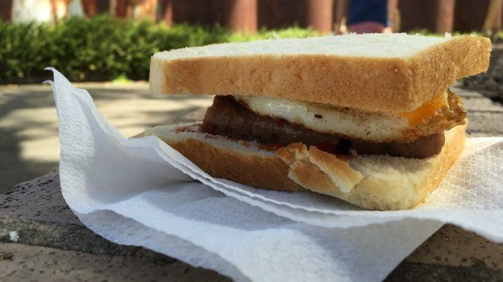 White bread but Tip Top: The sausage sizzle at Alexandria Park Community School. Photo: Rachel Olding