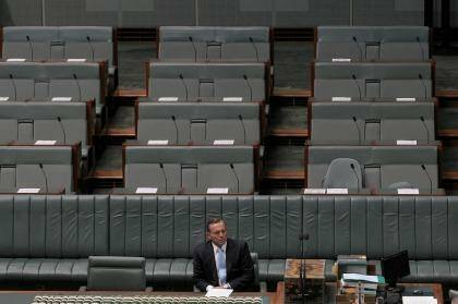 Prime Minister Tony Abbott cuts a lonely figure in Parliament on Monday. Photo: Alex Ellinghausen