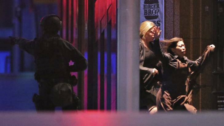 Hostages run from the Lindt Cafe after Jarrod Morton-Hoffman led the way. Photo: Andrew Meares