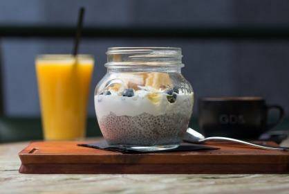 Coconut yoghurt chia pot with banana chips and fresh berries. Photo: Cole Bennetts