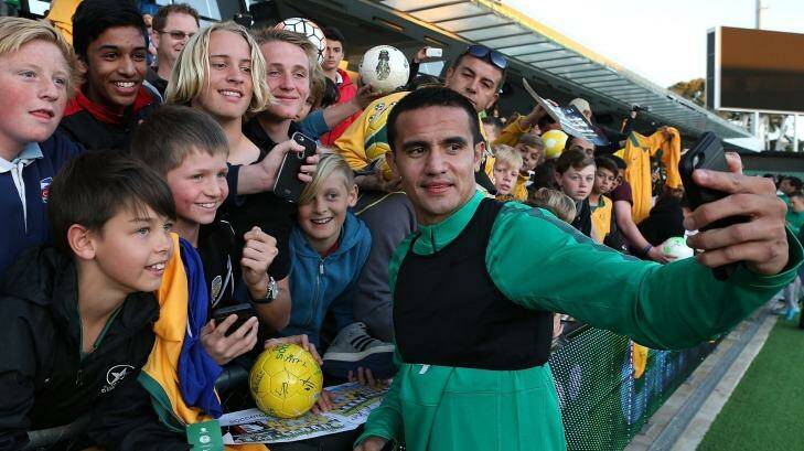 Tim Cahill takes a selfie with fans in Perth on Monday. Photo: Paul Kane