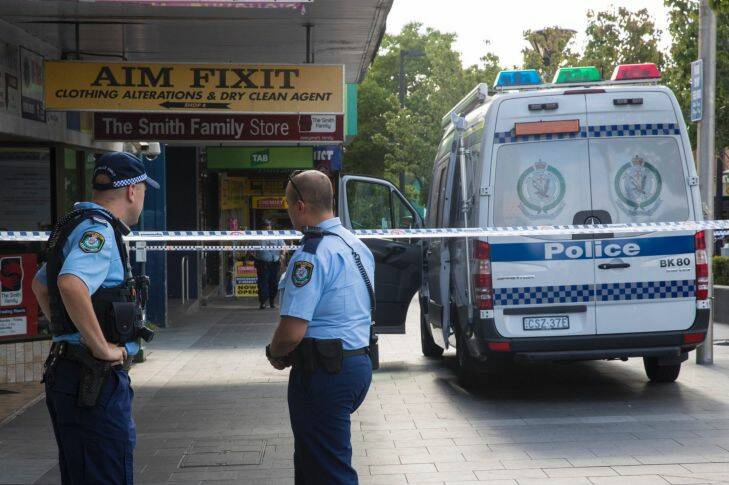 Police work a crime zone after a reported shooting in Bankstown  CBD in front of Chemist Warehouse. Photo by Cole Bennetts