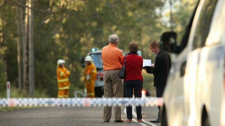 Police interview witnesses at a roadblock near the scene of an ultralight plane crash at Lovedale. Photo: Dean Osland 