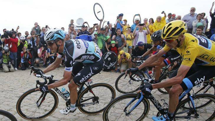 Stage winner and new overall leader Germany's Tony Martin is followed by Britain's Christopher Froome, right, during the fourth stage of the Tour de France from Seraing in Belgium to Cambrai in France on Tuesday. Photo: Christophe Ena