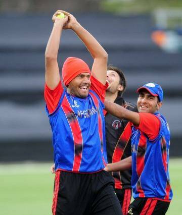 All smiles: The Afghanistan cricket team trains at Manuka Oval on Thursday. Photo: Graham Tidy