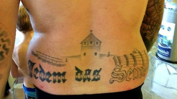 A member of Germany's extreme right-wing party shocks water park visitors with tasteless tattoo. Photo: Facebook