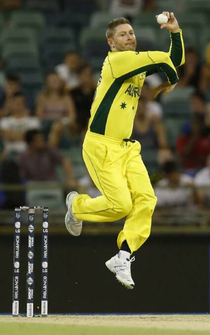 Bowling not batting: Australia's Michael Clarke in the match against Afghanistan. Photo: Theron Kirkman