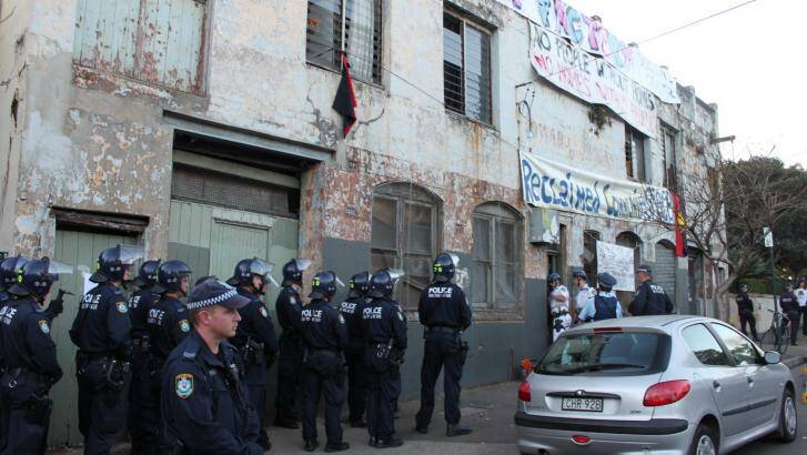 Police in riot gear as the first door at the Hat Factory is destroyed. Photo: Nina Vinther