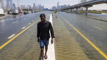 The United Arab Emirates is cleaning up after being hit by its heaviest recorded rainfall. (AP PHOTO)