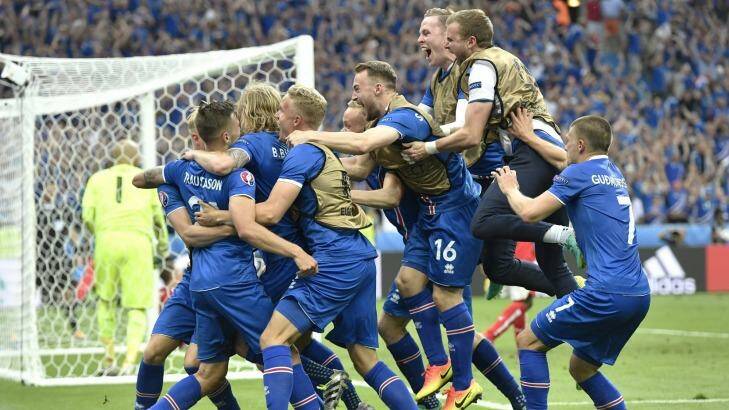 England await: Iceland players celebrate going through after defeating Austria. Photo: Martin Meissner