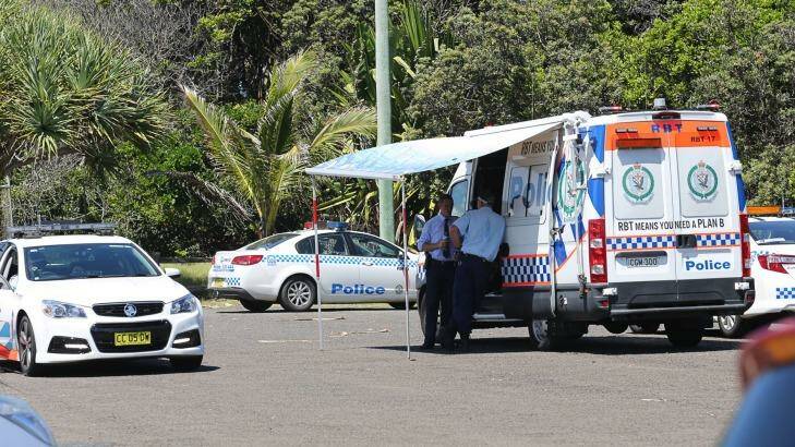 Police vehicles at Shelly Beach on Monday after a surfer was killed by a shark.
 Photo: Natalie Grono