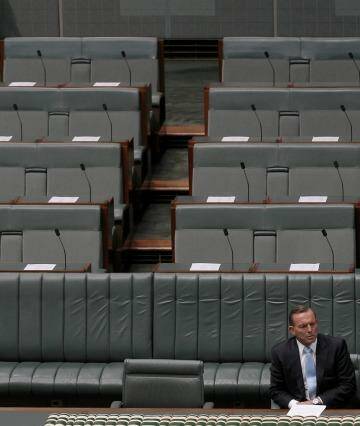Prime Minister Tony Abbott cuts a lonely figure in Parliament on Monday. Photo: Alex Ellinghausen