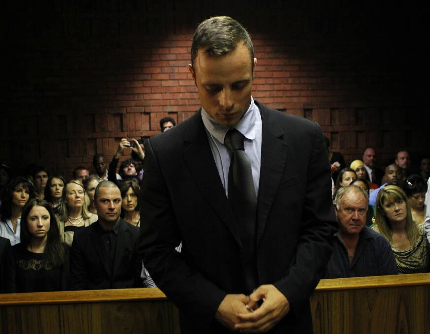 Olympic and Paralympic track athlete Oscar Pistorius stands in the dock ahead of court proceedings at the Pretoria magistrates court, in this picture taken on February 22, 2013. Photo: Reuters.