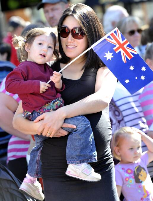 Anzac Day march down Baylis Street. Kara Normington of Wagga with daughter Mia, 2. Picture: Les Smith