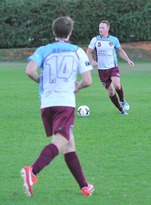 Griffith soccer. Eastern Wanderers v Yoogali. Matt Barneo looks to get ball to Chris Durman. Picture: Kieren L Tilly