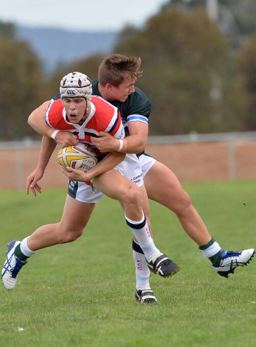 March 24. The Riverina Anglican College v Kildare Catholic College. Kildare's Derek Hay is tackled by TRAC's Blake Jorgensen. Picture: Michael Frogley 