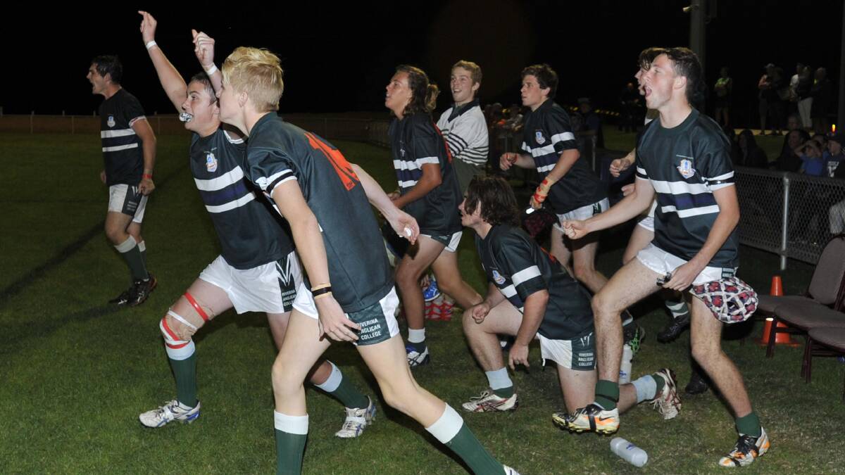 April 7. Hardy Shield grand final. The Riverina Anglican College v Kildare Catholic College. TRAC players run onto the field after winning the game. Picture: Les Smith 