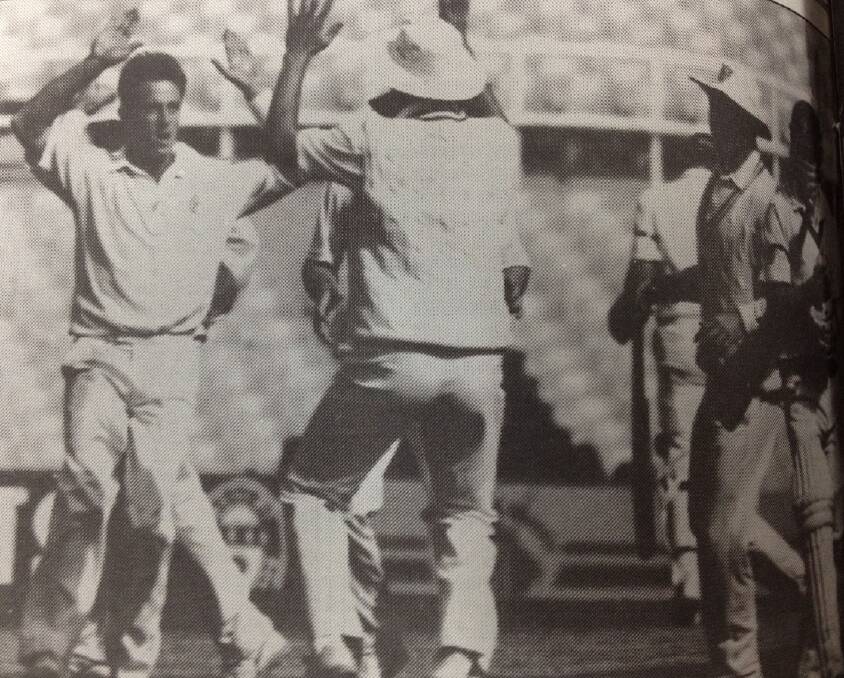 NSW speedster Wayne Holdsworth celebrates the wicket of Queensland captain Dirk Wellham in the Sheffield Shield final at the SCG.