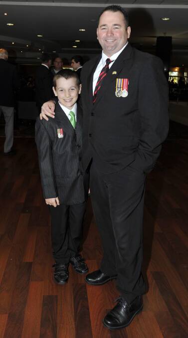 Tim McNamara with his son Tim Junior, 10, at the RSL Club. Picture: Les Smith