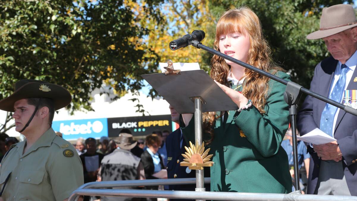 Anzac Day in Griffith. Griffith High school captain Brooke Kirby reads a prayer. Picture: Anthony Stipo 