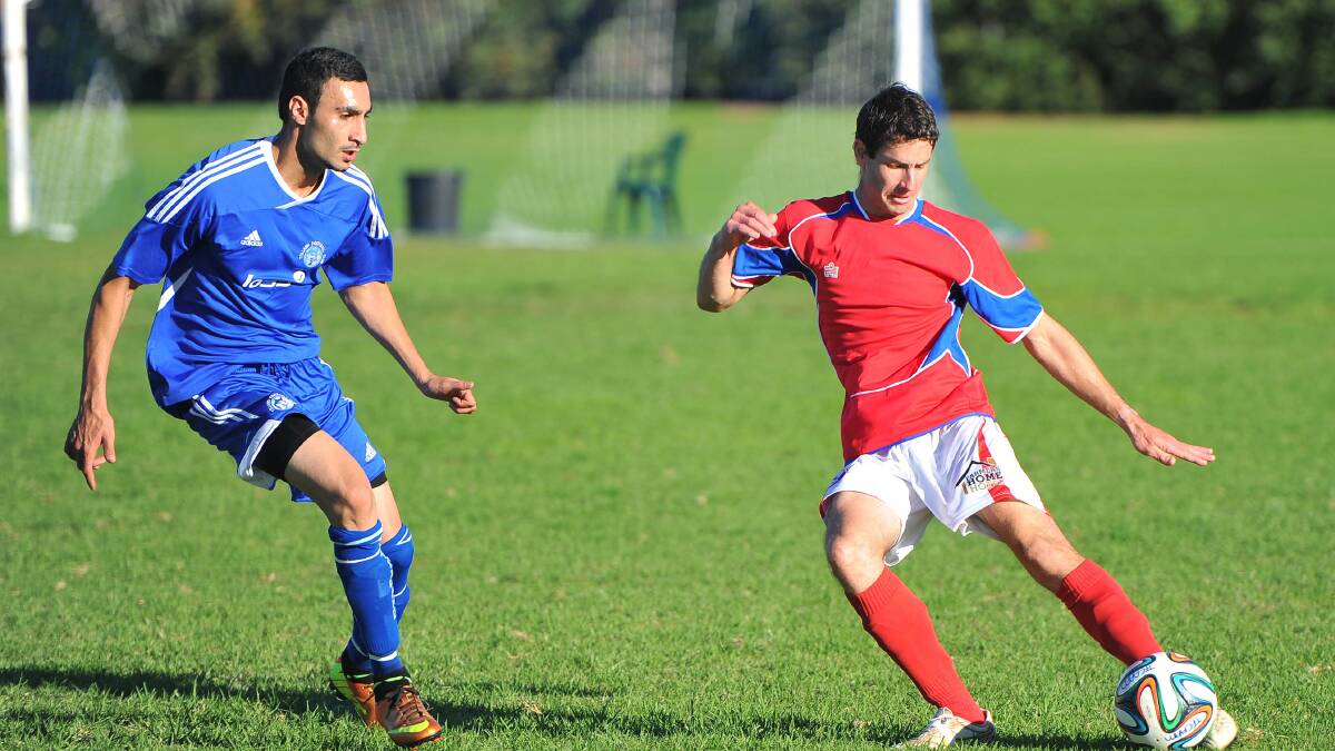 Wagga soccer. Tolland v Henwood Park. Tolland's Frederick Gardner and Henwood Park's Leigh Hutchinson. Picture: Kieren L Tilly