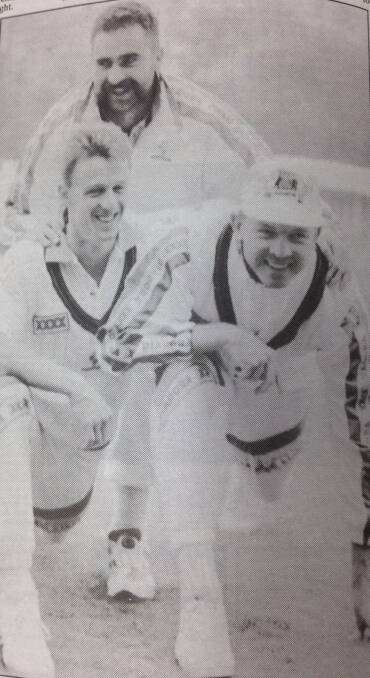 Australian cricketers Wayne Holdsworth, Merv Hughes (back) and Craig McDermott joke around during a light training session at Lord's cricket ground in London.