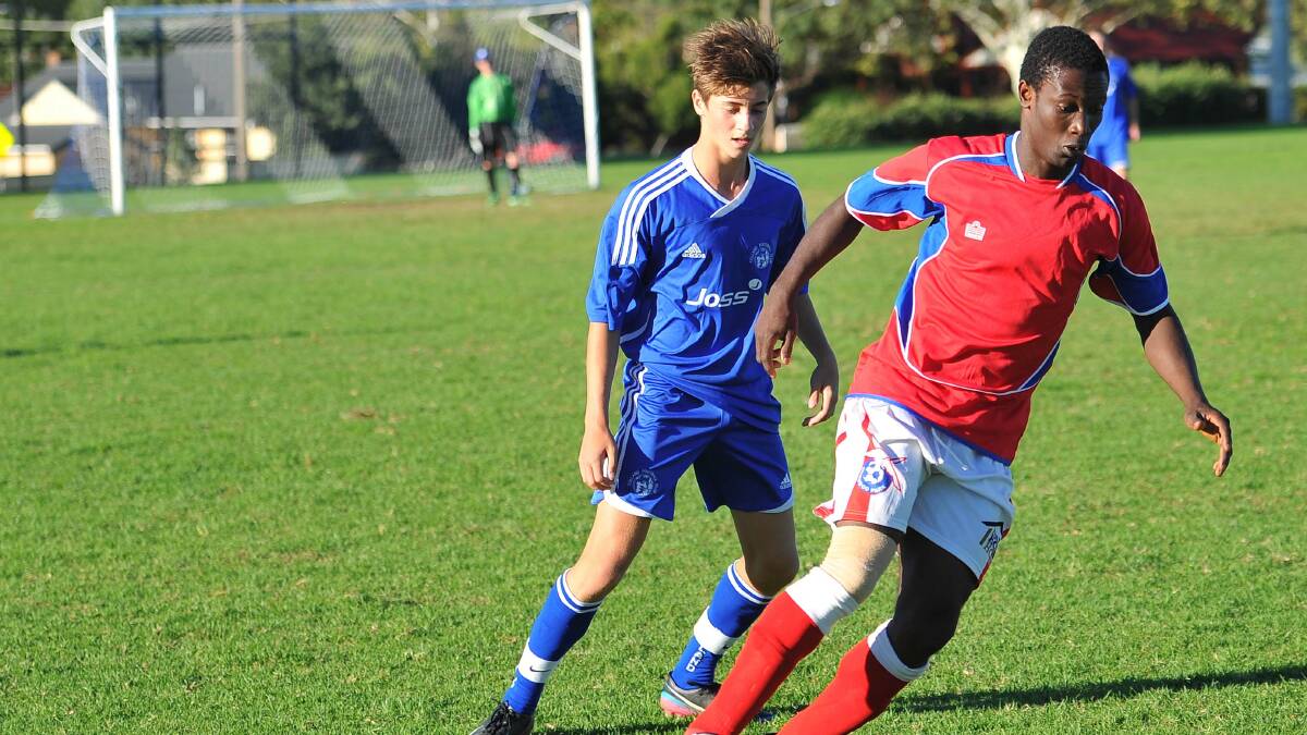 Wagga soccer. Tolland v Henwood Park. Tolland's Nicholas Tsipens and Henwood Park's Abdul Sillah. Picture: Kieren L Tilly 