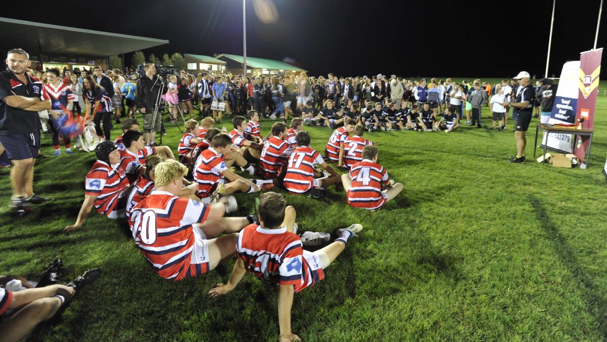 April 7. Hardy Shield grand final. The Riverina Anglican College v Kildare Catholic College. Kildare players sit on the ground in defeat. Picture: Les Smith 