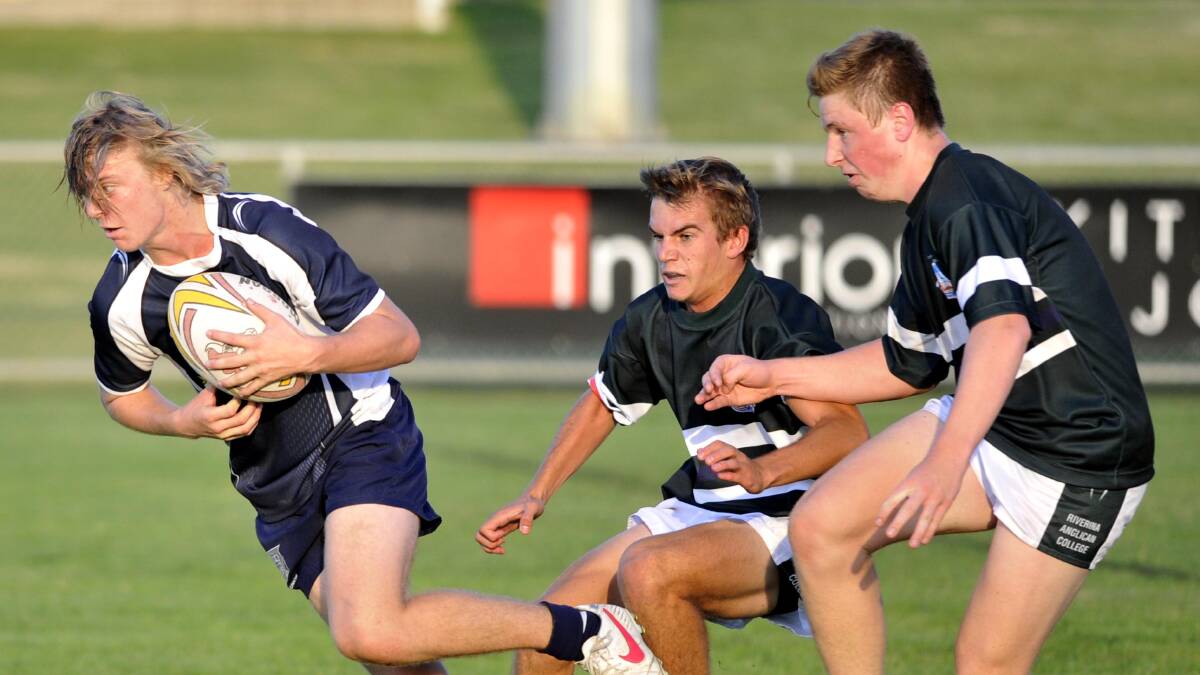 April 2. The Riverina Anglican College v Wagga High School. Wagga High's Cameron Andrews is about to be tackled by Blake Jorgensen and Lachie Moore. Picture: Les Smith 