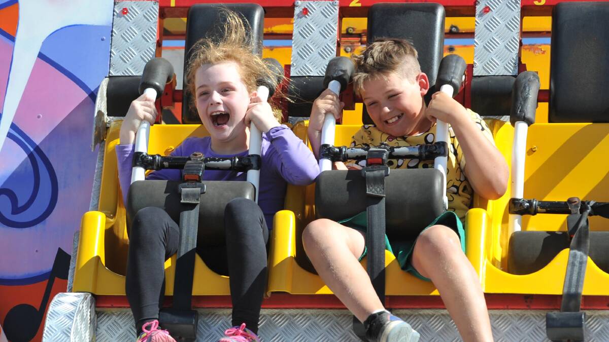 Thrillseekers: Katie Forbes, ,7 of Wagga and Darcey Holden, 10, of Coolamon take a ride at the Wagga Show. Picture: Michael Frogley