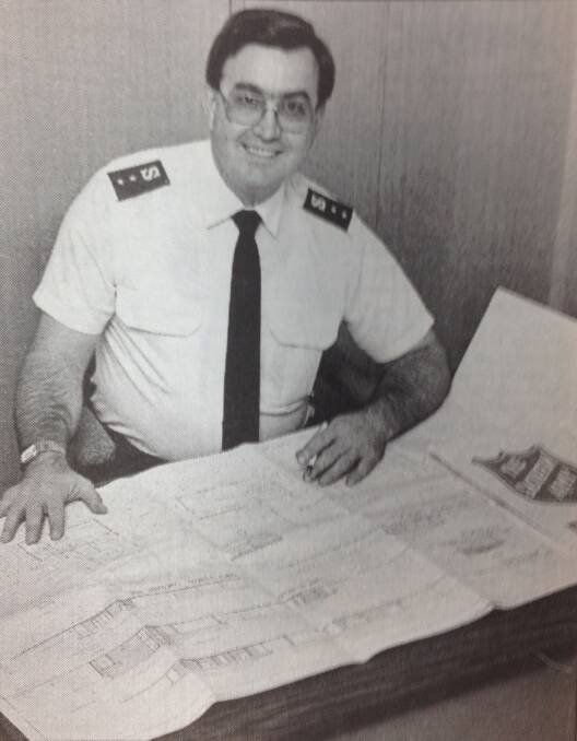 Captain Brian Unicomb from The Salvation Army with building plans for the organisation's upgrade in Edward Street.