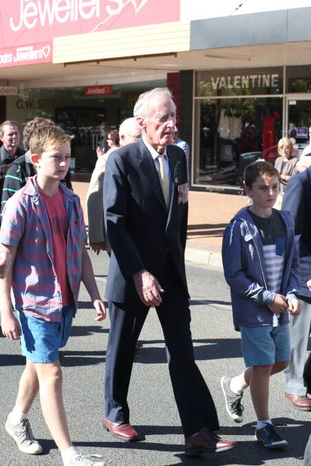 Anzac Day in Griffith. Reg Gilbert with his grandsons Jack Gilbert, 12, and Liam Gilbert, 10. Picture: Anthony Stipo 