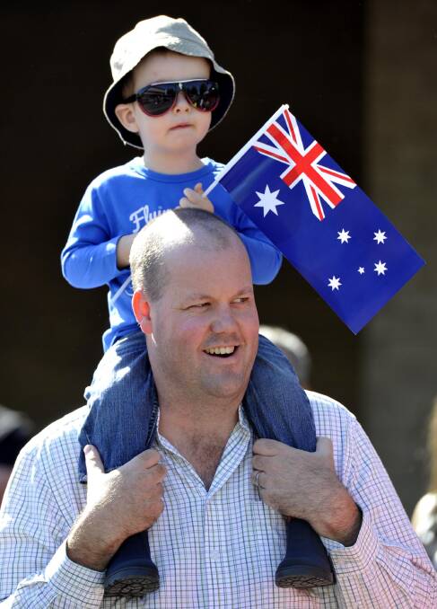 Anzac Day march down Baylis Street. Ben Goodwin of Wagga with his son Alex, 20 months. Picture: Les Smith
