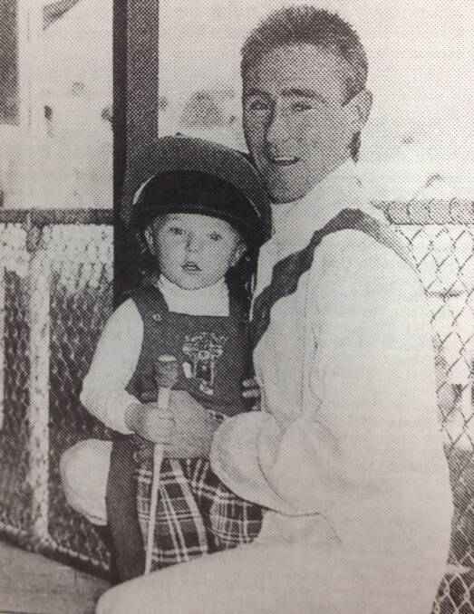Former Wagga jockey Donald Terry, with son Kyle, 2, prior to the final event at Holbrook.